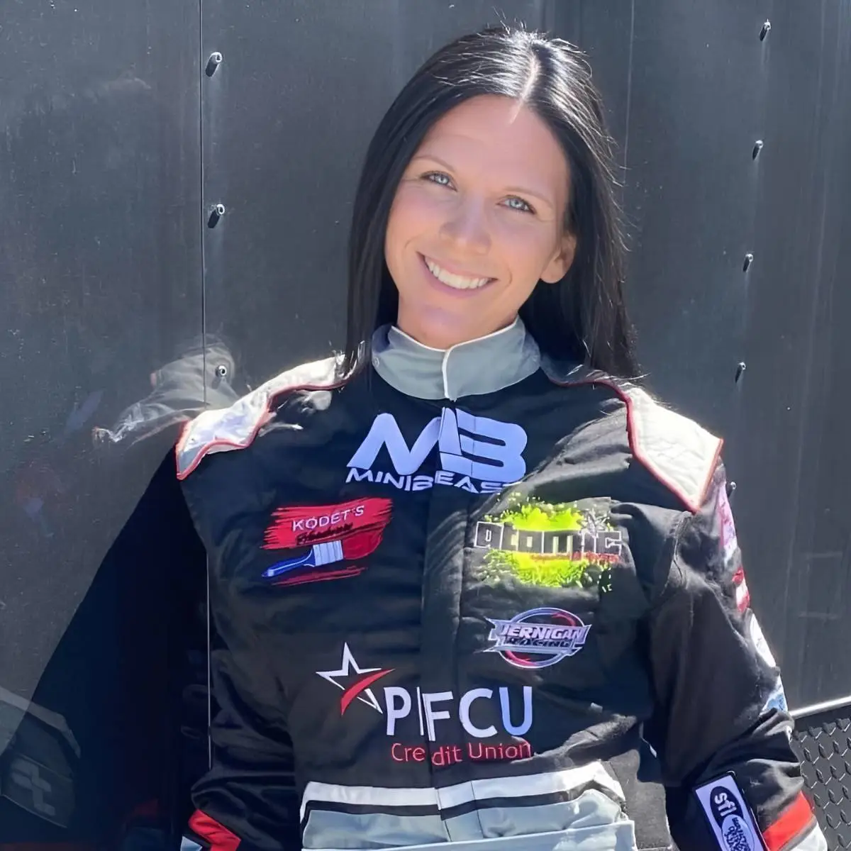 Driver wearing a FervoGear custom race suit