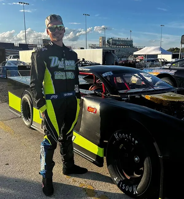 Driver wearing a FervoGear custom race suit