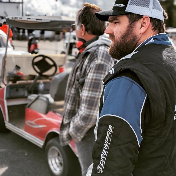 Driver wearing a FervoGear custom race suit